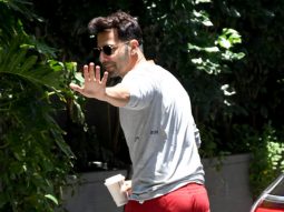 Varun Dhawan rocks those red pants as he poses for paps
