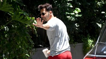 Varun Dhawan rocks those red pants as he poses for paps