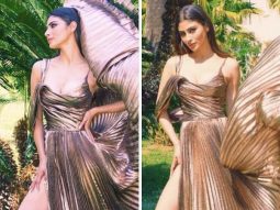 Mouni Roy gives us a hefty dose of glam in a stunning metallic dress that features multiple pleats and a daring side slit