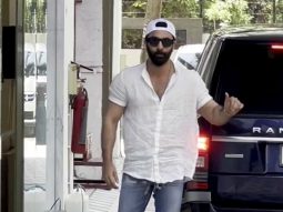 Ranbir Kapoor poses for paps in a white shirt and denims