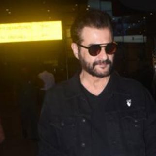Sanjay Kapoor poses for a selfie with fans at the airport