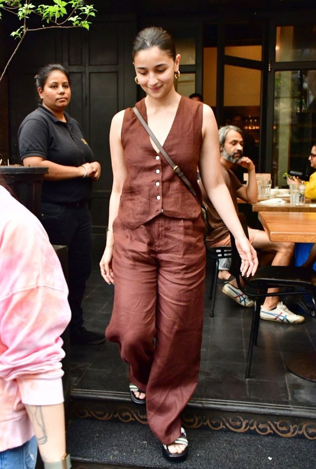 Alia Bhatt perfects the relaxed elegant look with casual brown pants and a waistcoat, together with a Gucci bag costing Rs.  1.35 lakhs