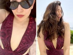 Karisma Kapoor in a maroon snakeskin patterned monokini is the most stylish beach babe