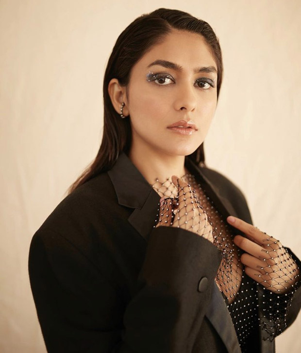 Mrunal Thakur makes a statement in her bewitching black pantsuit with a splash of sparkle from a net top