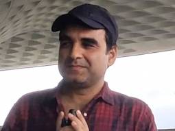 Pankaj Tripathi smiles as he poses for paps at the airport