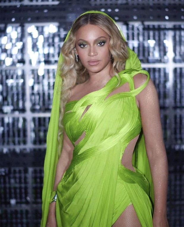 Beyonce amps up the drama on stage in a stunning green sari gown by designer Gaurav Gupta at the Renaissance World Tour concert