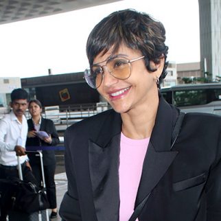 Mandira Bedi gets clicked at the airport as she greets paps