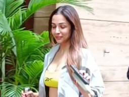 Neon Queen Malaika Arora waves at paps as she gets clicked