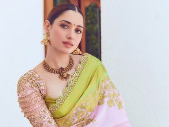 Tamannaah Bhatia helps a fan after security guard tries to hold him back; fans of the actress praise her for her kind gesture Tamannaah Bhatia helps a fan after security guard tries to hold him back; fans of the actress praise her for her kind gesture