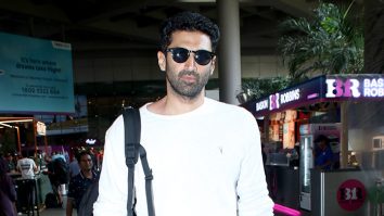 Aditya Roy Kapur poses with fans as he gets clicked at the airport