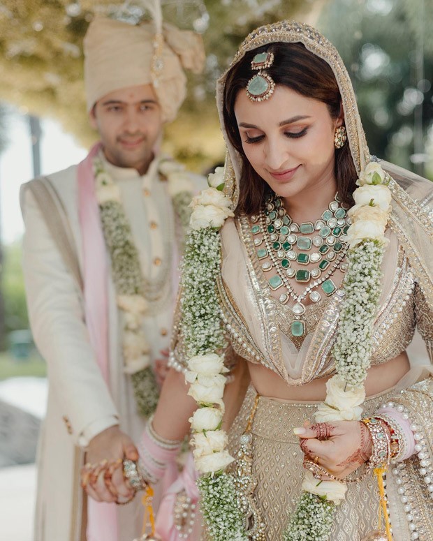 Parineeti Chopra and Raghav Chadda adorn pastel ensembles by Manish Malhotra and Pawan Sachdeva, creating a perfect wedding look