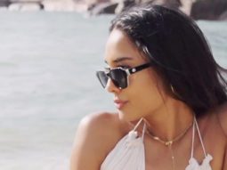 Beach baby! Lisa Haydon looks divine in white