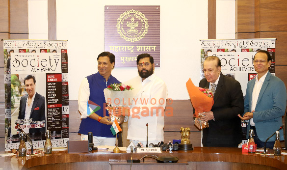 photos madhur bhandarkar along with honorable maharashtra cm eknath shinde and others unveil the latest cover of society achievers magazine 2