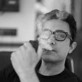 Aamir Khan enjoys his cigar in charismatic post pack up shoot, see black and white photo