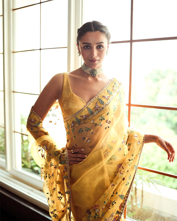Alia Bhatt exudes regal opulence in yellow aviary pattern saree accentuated with statement pearl neckpiece; her braided hair steals the limelight 