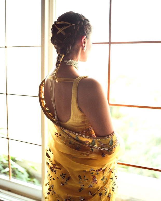 Alia Bhatt exudes regal opulence in yellow aviary pattern saree accentuated with statement pearl neckpiece; her braided hair steals the limelight 