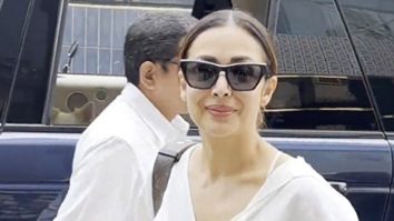 Malaika Arora waves at paps as she gets clicked in an all white outfit