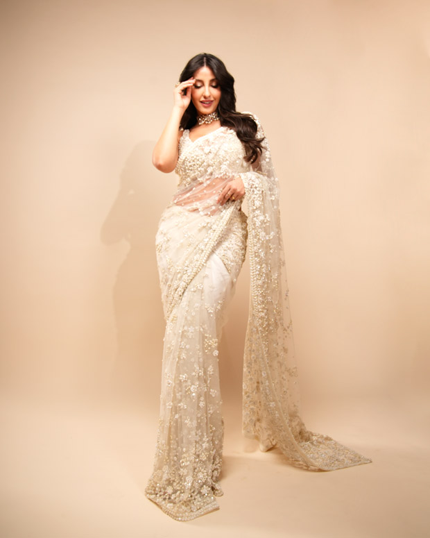 Nora Fatehi channels her inner desi diva in an ivory saree by Seema Gujral