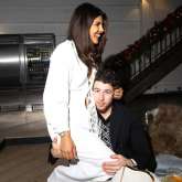 Priyanka Chopra Jonas gives a glimpse of her Christmas holiday season celebrations, as she sits on Nick Jonas’ lap