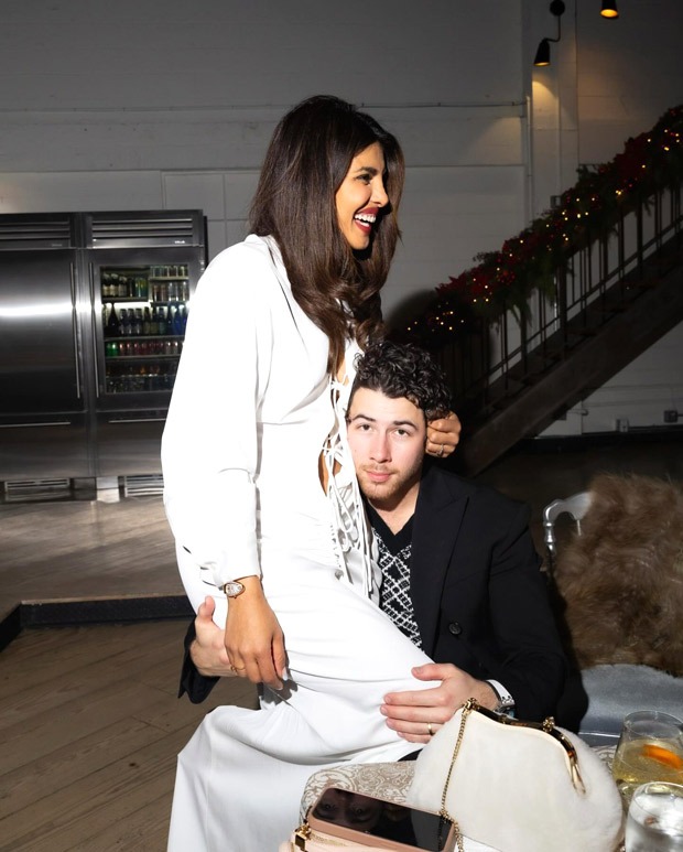 Priyanka Chopra Jonas gives a glimpse of her Christmas holiday season celebrations, as she sits on Nick Jonas’ lap