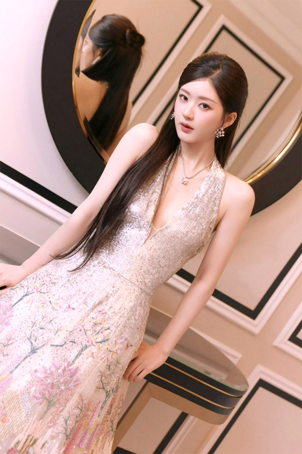Zhao Lusi, Chinese actress, radiates glamour in Indian designer Rahul Mishra's silver halter gown with delicate floral embroidery