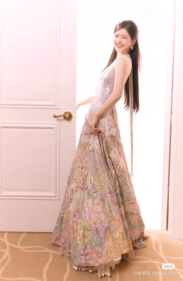 Zhao Lusi, Chinese actress, radiates glamour in Indian designer Rahul Mishra's silver halter gown with delicate floral embroidery