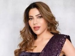 Nikki Tamboli shines in her shimmery black saree!
