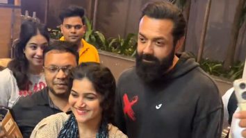 Bobby Deol poses for a picture with fans as he steps out in the city