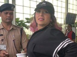 Neha Bhasin waves at paps as she gets clicked at the airport
