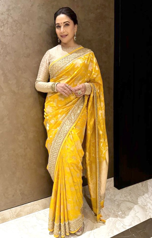 Madhuri Dixit continues her stylish saree streak in glorious yellow saree by Anita Dongre worth Rs.70,000