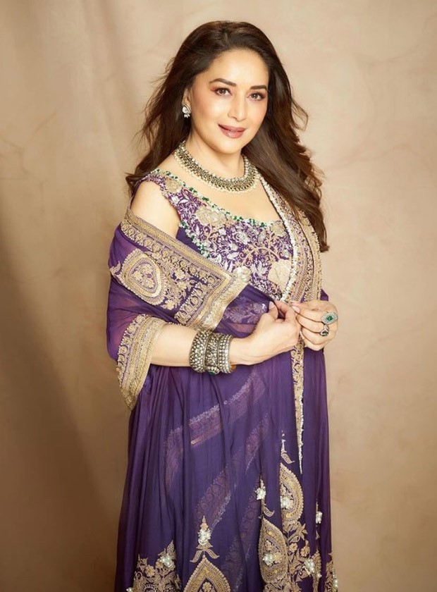Madhuri Dixit made a chic case for a purple statement pre-draped saree by Anamika Khanna perfect for the festive season