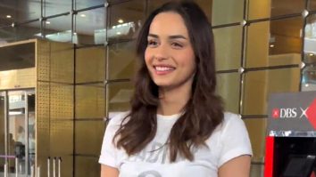 Manushi Chhillar sports a casual look as she poses for a picture with fan at the airport