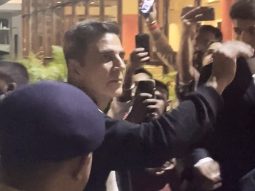 Akshay Kumar waves at his fans as he gets clicked by paps