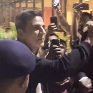 Akshay Kumar waves at his fans as he gets clicked by paps