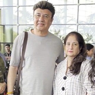 Anu Malik poses with family as he gets clicked at the airport