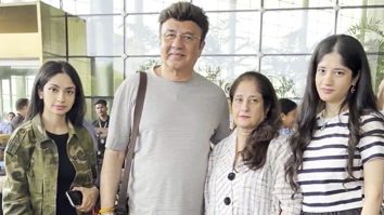 Anu Malik poses with family as he gets clicked at the airport