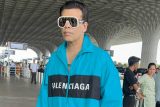 King of airport looks! Karan Johar arrives in style at the airport