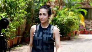 Malaika Arora poses for a picture with a fan post her workout session