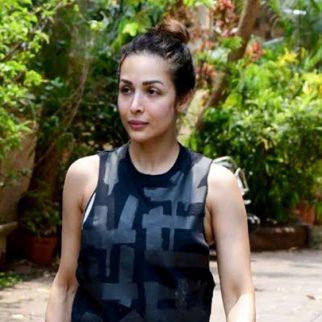 Malaika Arora poses for a picture with a fan post her workout session