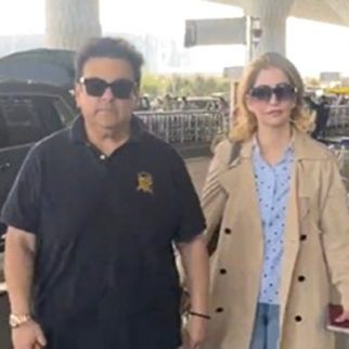 Adnan Sami poses with family as he gets clicked at the airport