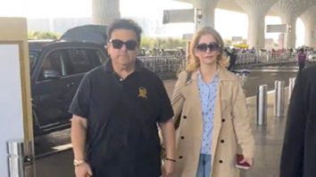 Adnan Sami poses with family as he gets clicked at the airport