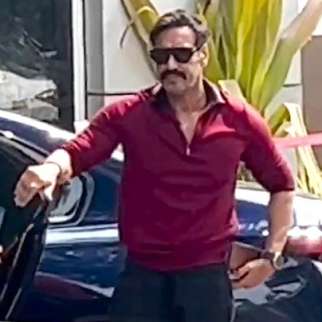 Ajay Devgn gets clicked in his casual red t-shirt at the airport