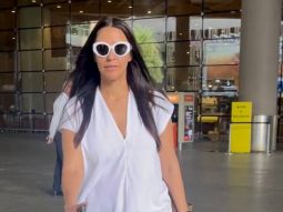 Neha Dhupia poses for a selfie with fans at the airport