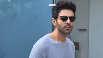 Kartik Aaryan poses with a fan as he gets clicked in the city