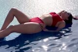 Turning up the heat in her red hot bikini! Sunny Leone