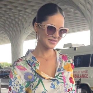 Sunny Leone cheerfully greets paps at the airport