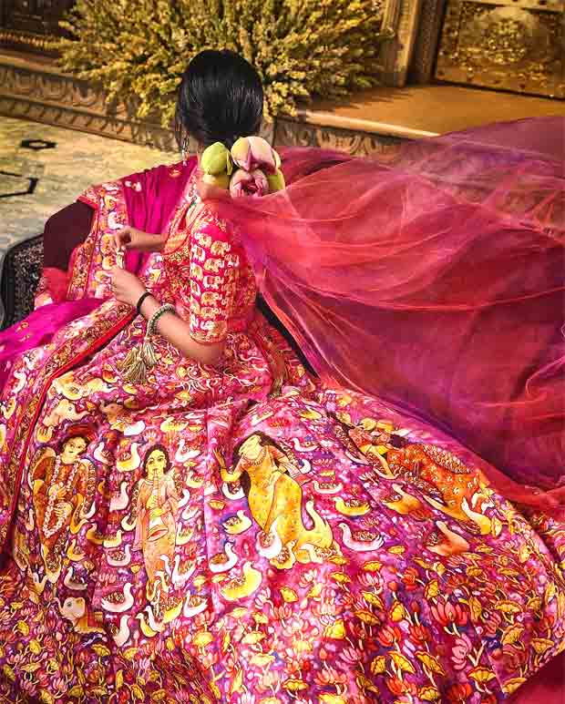 Anant Ambani–Radhika Merchant Wedding Newlywed bride exudes opulence in custom Abu Jani Sandeep Khosla red lehenga featuring 12 hand-painted panels