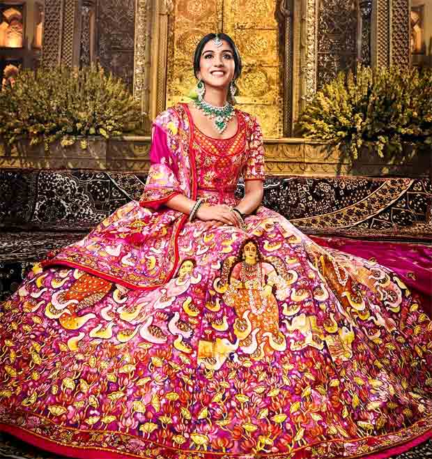 Anant Ambani–Radhika Merchant Wedding Newlywed bride exudes opulence in custom Abu Jani Sandeep Khosla red lehenga featuring 12 hand-painted panels