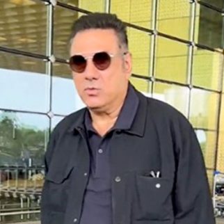 Boman Irani clicks a picture with paps as he gets clicked at the airport