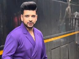 Karan Kundrra waves at paps as he gets clicked on a set